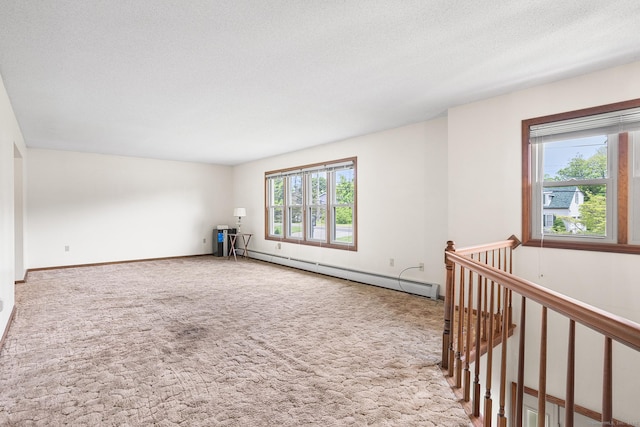 1441 Woodtick Rd, Wolcott, CT 06716 - carpeted spare room with a baseboard heating unit, baseboards, and a textured ceiling