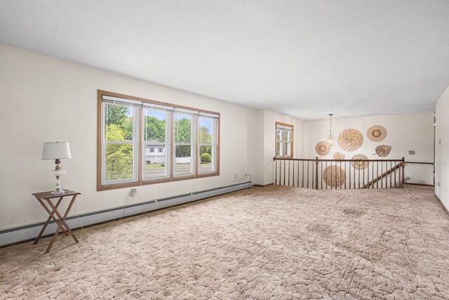 1441 Woodtick Rd, Wolcott, CT 06716 - carpeted spare room with baseboard heating and a textured ceiling