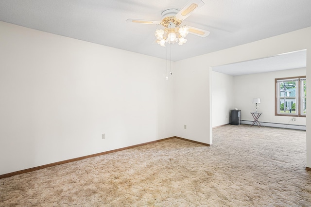 1441 Woodtick Rd, Wolcott, CT 06716 - empty room with a baseboard heating unit, ceiling fan, carpet, and baseboards