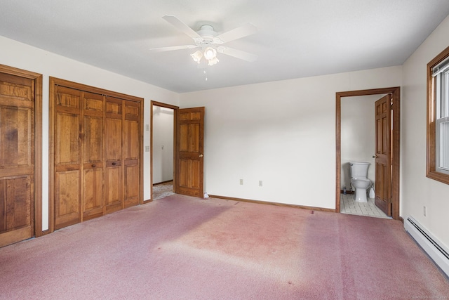 1441 Woodtick Rd, Wolcott, CT 06716 - unfurnished bedroom with a baseboard heating unit, light colored carpet, baseboards, ensuite bathroom, and multiple closets
