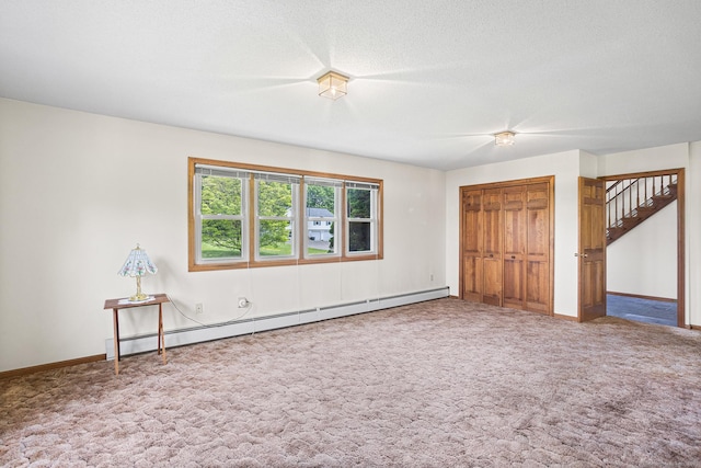 1441 Woodtick Rd, Wolcott, CT 06716 - unfurnished room featuring baseboard heating, carpet flooring, baseboards, and a textured ceiling