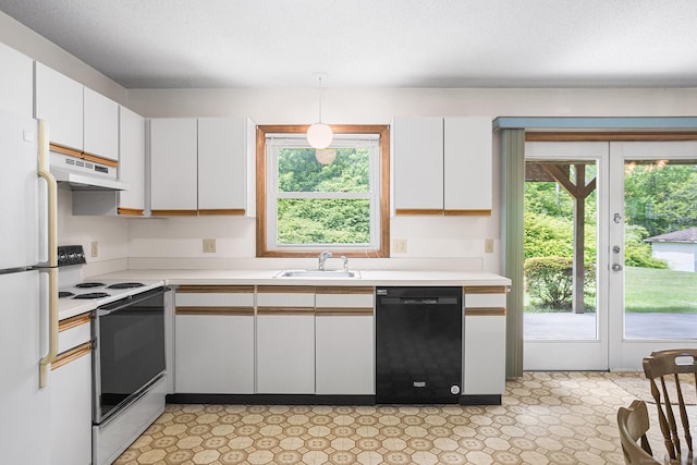 1441 Woodtick Rd, Wolcott, CT 06716 - kitchen featuring dishwasher, range with electric stovetop, under cabinet range hood, freestanding refrigerator, and a sink