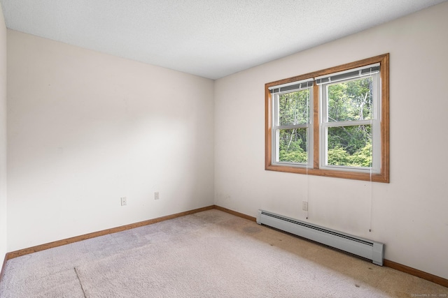 1441 Woodtick Rd, Wolcott, CT 06716 - empty room featuring a baseboard heating unit, light colored carpet, and baseboards