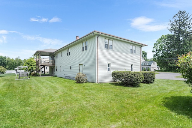 1441 Woodtick Rd, Wolcott, CT 06716 - view of property exterior with a chimney, a lawn, and a wooden deck