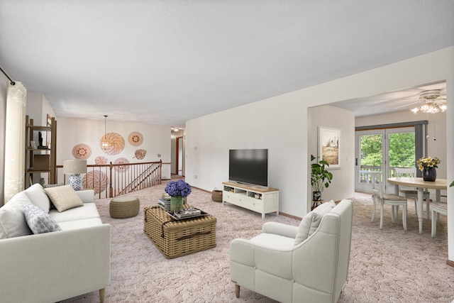 1441 Woodtick Rd, Wolcott, CT 06716 - living area featuring carpet floors, a chandelier, and a ceiling fan