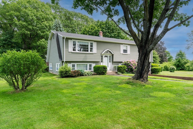 39 Ivy Dr, Southington, CT 06489 - raised ranch featuring a chimney and a front lawn
