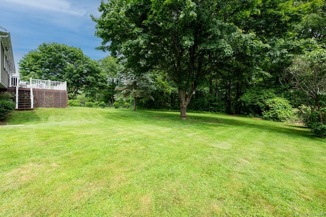 39 Ivy Dr, Southington, CT 06489 - view of grassy yard with a deck and stairs