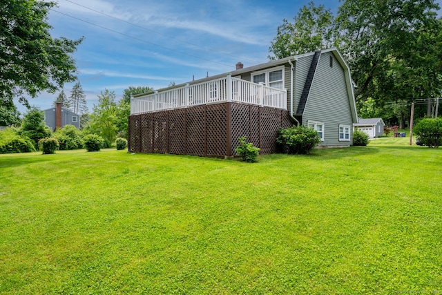 39 Ivy Dr, Southington, CT 06489 - rear view of house featuring a lawn, a wooden deck, and a chimney