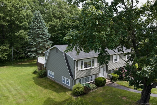 39 Ivy Dr, Southington, CT 06489 - view of side of property featuring a lawn and a shingled roof