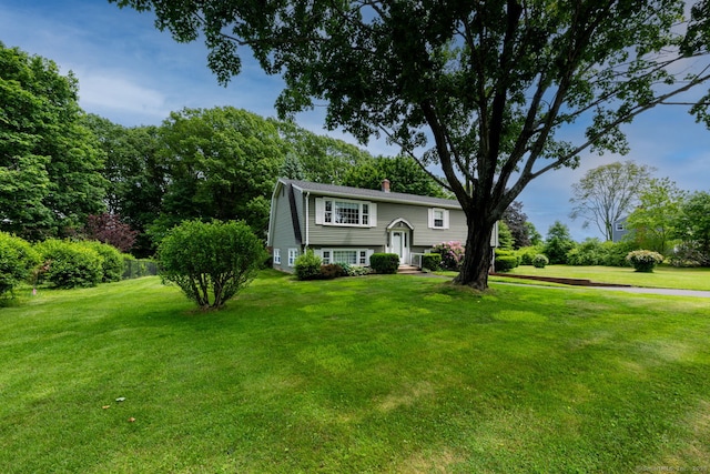 39 Ivy Dr, Southington, CT 06489 - split foyer home with a chimney and a front lawn