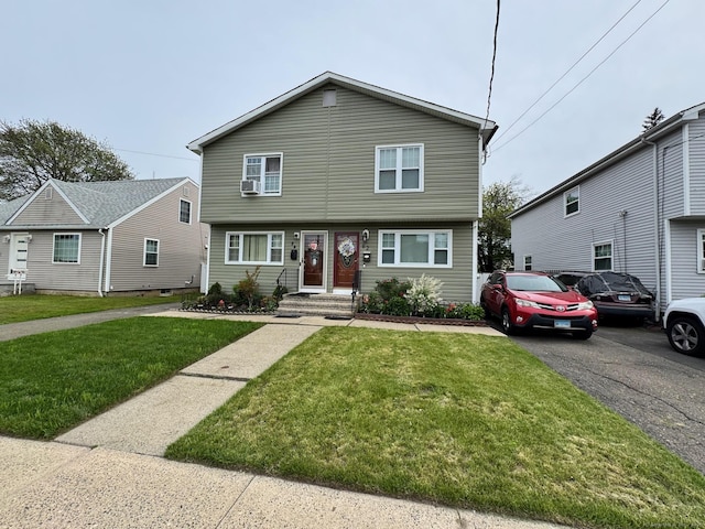 82 Louisiana Ave, Bridgeport, CT 06610 - view of front facade with a front lawn