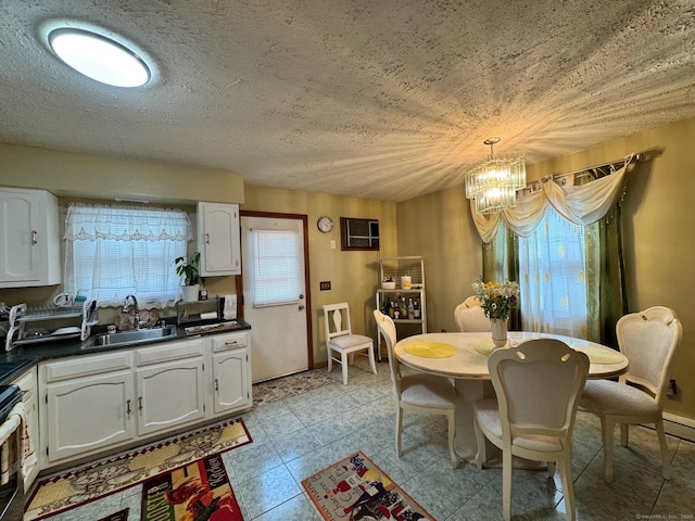 82 Louisiana Ave, Bridgeport, CT 06610 - dining room with a chandelier and a textured ceiling