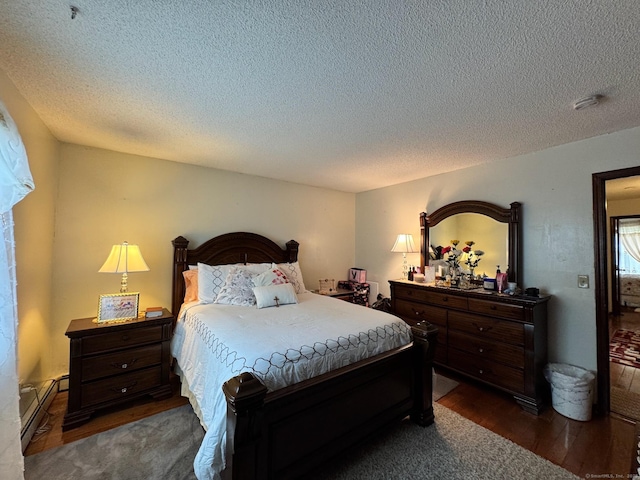 82 Louisiana Ave, Bridgeport, CT 06610 - bedroom featuring dark wood-type flooring, baseboard heating, and a textured ceiling