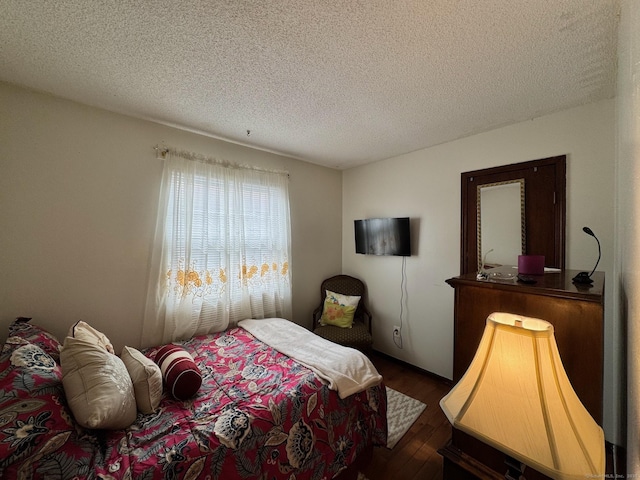 82 Louisiana Ave, Bridgeport, CT 06610 - bedroom featuring dark wood-style flooring and a textured ceiling