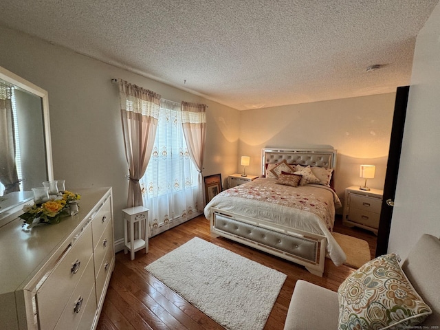 82 Louisiana Ave, Bridgeport, CT 06610 - bedroom with a textured ceiling and wood finished floors
