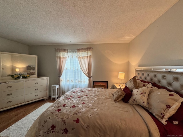 82 Louisiana Ave, Bridgeport, CT 06610 - bedroom with dark wood finished floors and a textured ceiling