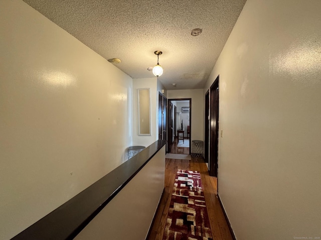 82 Louisiana Ave, Bridgeport, CT 06610 - hallway with dark wood-type flooring and a textured ceiling
