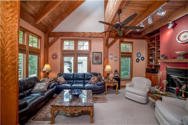 9A Obtuse Rocks Rd, Brookfield, CT 06804 - carpeted living area with a wood ceiling with exposed beams, track lighting, a glass covered fireplace, a towering ceiling, and ceiling fan