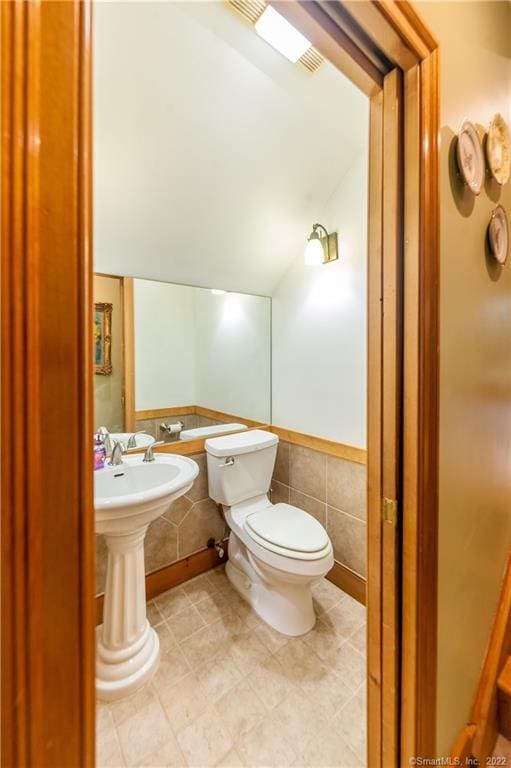 9A Obtuse Rocks Rd, Brookfield, CT 06804 - half bathroom featuring toilet and lofted ceiling