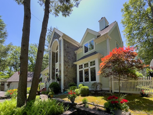 9A Obtuse Rocks Rd, Brookfield, CT 06804 - view of property exterior with stone siding and a chimney