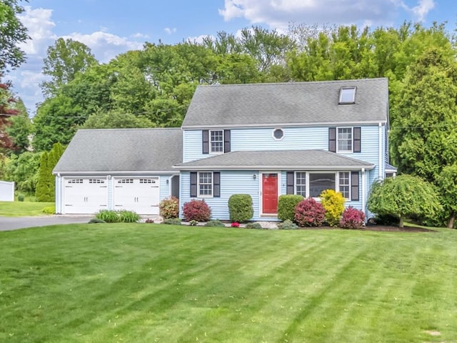 146 Shunpike Rd, Cromwell, CT 06416 - view of front of property with asphalt driveway, a front lawn, an attached garage, and view of wooded area