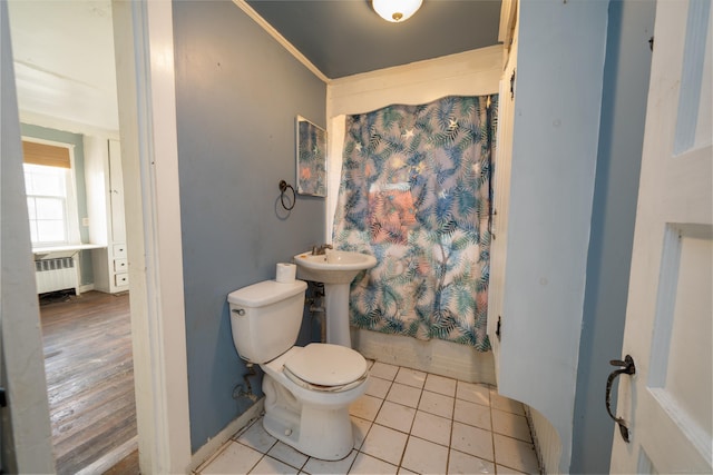 25 Gray Ledge Rd, Branford, CT 06405 - full bath featuring radiator heating unit, toilet, tile patterned flooring, shower / bathtub combination with curtain, and a sink