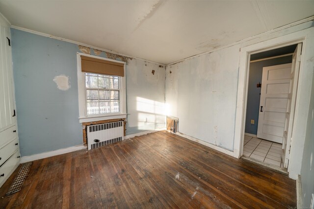 25 Gray Ledge Rd, Branford, CT 06405 - spare room featuring radiator heating unit, wood-type flooring, baseboards, and crown molding