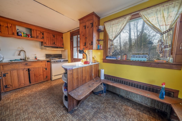 25 Gray Ledge Rd, Branford, CT 06405 - kitchen featuring gas range gas stove, a sink, open shelves, and brown cabinets
