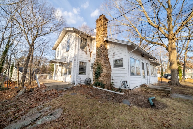 25 Gray Ledge Rd, Branford, CT 06405 - rear view of house featuring a chimney