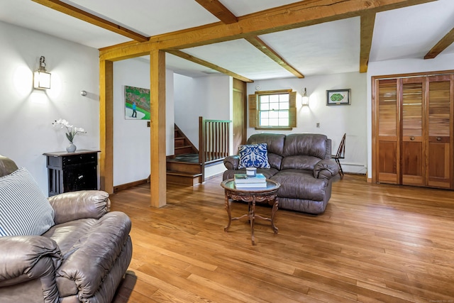 475 Hoyt St, Darien, CT 06820 - living room with beam ceiling, stairway, light wood-style flooring, baseboards, and a baseboard radiator