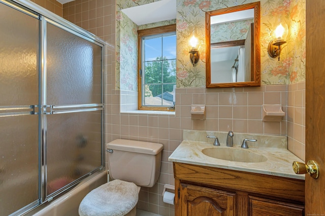 475 Hoyt St, Darien, CT 06820 - full bath with wallpapered walls, tile walls, vanity, combined bath / shower with glass door, and toilet