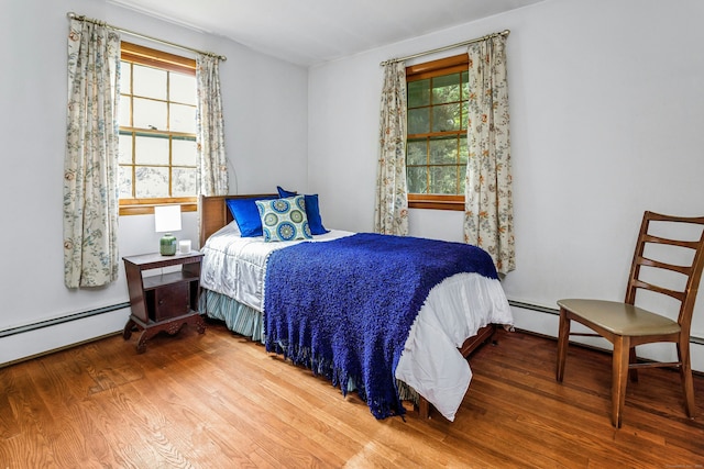 475 Hoyt St, Darien, CT 06820 - bedroom featuring wood finished floors and baseboard heating