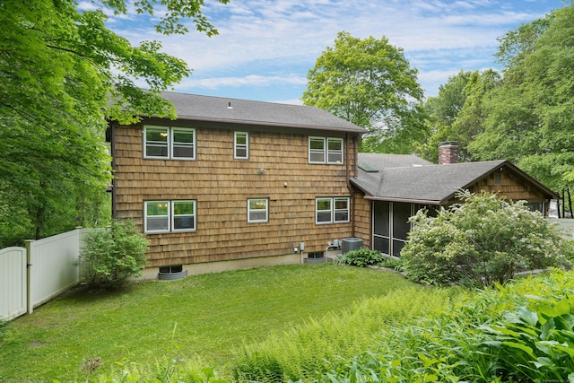 40 Spring Hill Ln, Bethel, CT 06801 - back of house with roof with shingles, a sunroom, cooling unit, and a chimney