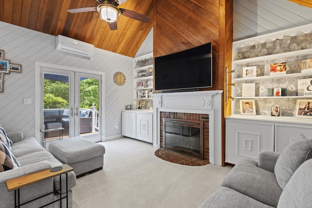 114 Dean Rd, East Lyme, CT 06333 - carpeted living area featuring an AC wall unit, a fireplace, wooden walls, french doors, and a ceiling fan