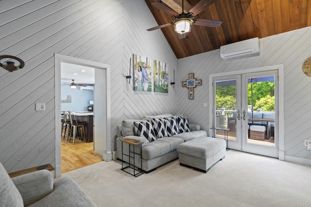 114 Dean Rd, East Lyme, CT 06333 - living room featuring a wall mounted AC, ceiling fan, wood walls, french doors, and carpet
