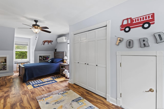 114 Dean Rd, East Lyme, CT 06333 - bedroom featuring a wall unit AC, wood finished floors, lofted ceiling, a closet, and ceiling fan