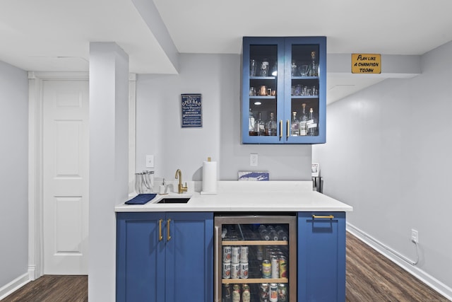 114 Dean Rd, East Lyme, CT 06333 - indoor wet bar featuring beverage cooler, dark wood-type flooring, and baseboards