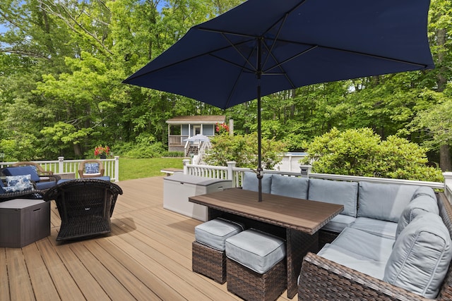 114 Dean Rd, East Lyme, CT 06333 - wooden deck with an outdoor living space, outdoor dining space, and view of wooded area