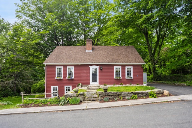 8 Cider Mill Rd, Tolland, CT 06084 - view of front of property featuring a chimney and a shingled roof