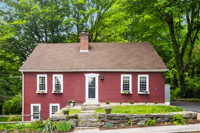 8 Cider Mill Rd, Tolland, CT 06084 - view of front of property featuring a chimney, a shingled roof, and entry steps
