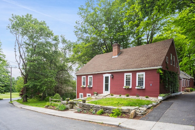 8 Cider Mill Rd, Tolland, CT 06084 - view of front of home with a chimney and a shingled roof
