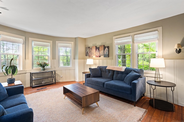 8 Cider Mill Rd, Tolland, CT 06084 - living area featuring wood finished floors, wainscoting, and a decorative wall