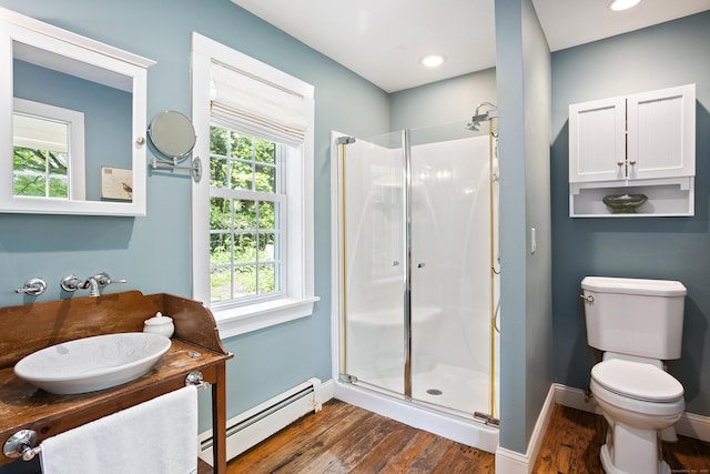 8 Cider Mill Rd, Tolland, CT 06084 - bathroom with a baseboard radiator, wood finished floors, a shower stall, and baseboards