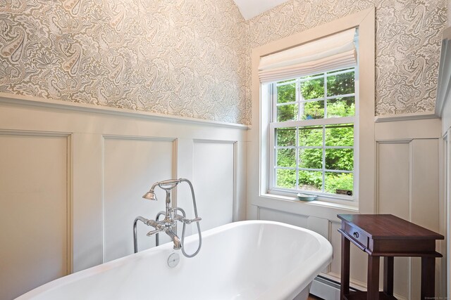 8 Cider Mill Rd, Tolland, CT 06084 - full bathroom featuring a decorative wall, a soaking tub, wallpapered walls, and wainscoting