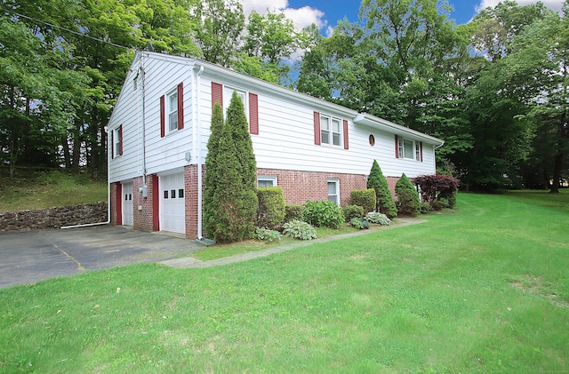 202 Wilson Rd, Orange, CT 06477 - view of property exterior featuring asphalt driveway, an attached garage, a lawn, and brick siding