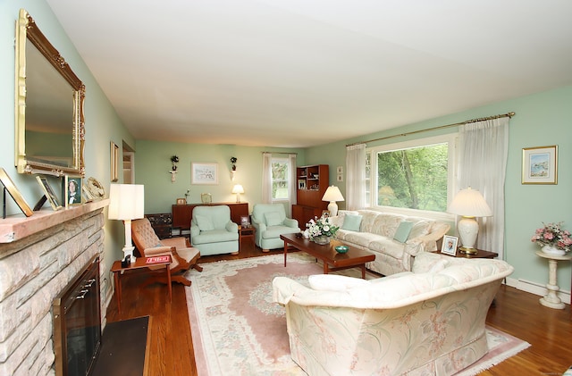 202 Wilson Rd, Orange, CT 06477 - living area featuring dark wood-type flooring and a stone fireplace