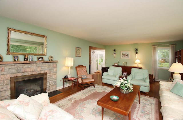 202 Wilson Rd, Orange, CT 06477 - living area with wood finished floors, baseboards, and a fireplace