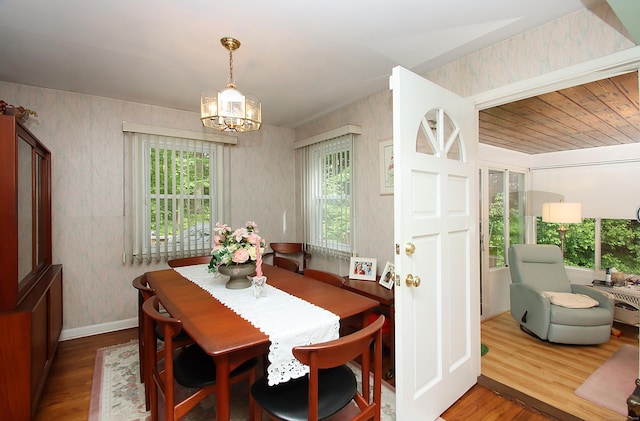 202 Wilson Rd, Orange, CT 06477 - dining space with plenty of natural light, wood finished floors, wallpapered walls, a chandelier, and baseboards
