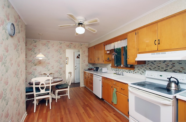 202 Wilson Rd, Orange, CT 06477 - kitchen with under cabinet range hood, white appliances, a sink, light wood finished floors, and wallpapered walls