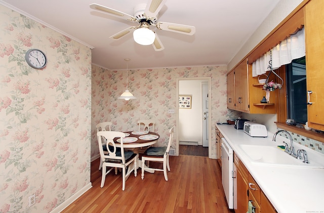 202 Wilson Rd, Orange, CT 06477 - kitchen with a sink, light wood finished floors, dishwasher, light countertops, and a ceiling fan